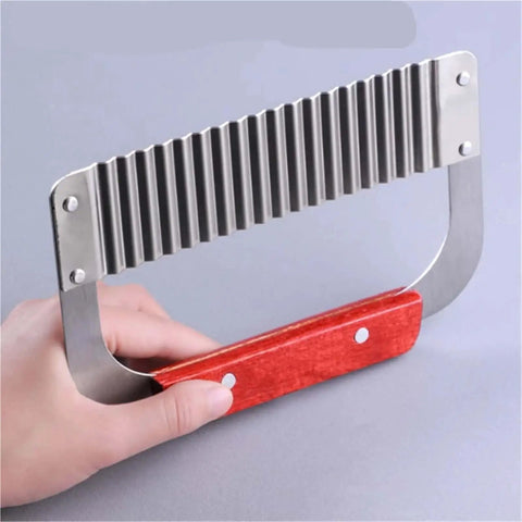 Handheld Crinkle Cutter for Veggies and Potatoes Stainless Steel Wavy Potato Chopper Knife, ergonomic grip, held in hand view