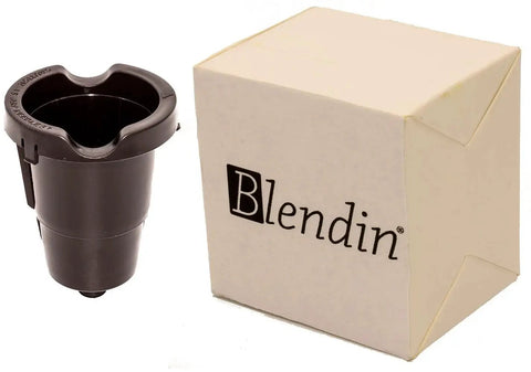 Front view of Blendin replacement K-Cup pod holder with exit needle, black plastic, beside beige box.