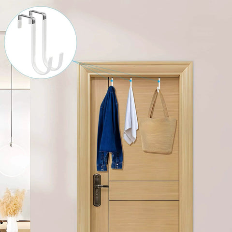 Over-door hooks with hanging clothes and bag showcasing storage solution.