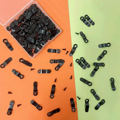 100 piece metal picture frame turn buttons and black screws set in transparent storage box on colorful background