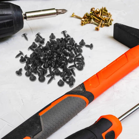 100 Pack M4 X 10mm Iron Screws Set For Home Improvement And Furniture Projects, surrounded by hammer and screwdriver.