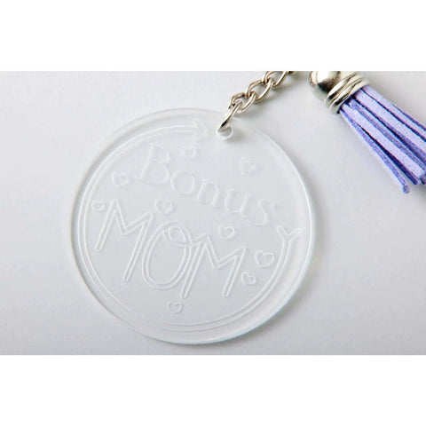 Clear acrylic round keychain engraved with 'Bonus Mom' using Pro Grade Engraving Tip With QuickSwap Housing And Premium Carbide Steel.