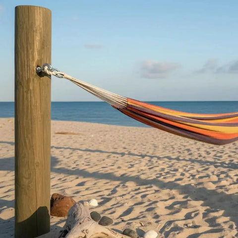 Hammock secured to wooden post using Eye Bolt 3/8 Inch By 4 Inch Zinc Plated, 10 Pack For Indoor And Outdoor Use at beach