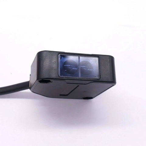 Indoor Wall Mounted Photoelectric Beam Sensor With Dual Voltage 12 To 240 VDC And 24 To 240 VAC, close-up view of sensor housing.