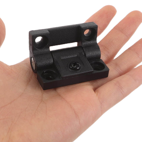 Plastic Folding Cabinet Door Hinges OSALADI 90 Degree Right Angle Torque Positioning in hand, showing size and design.
