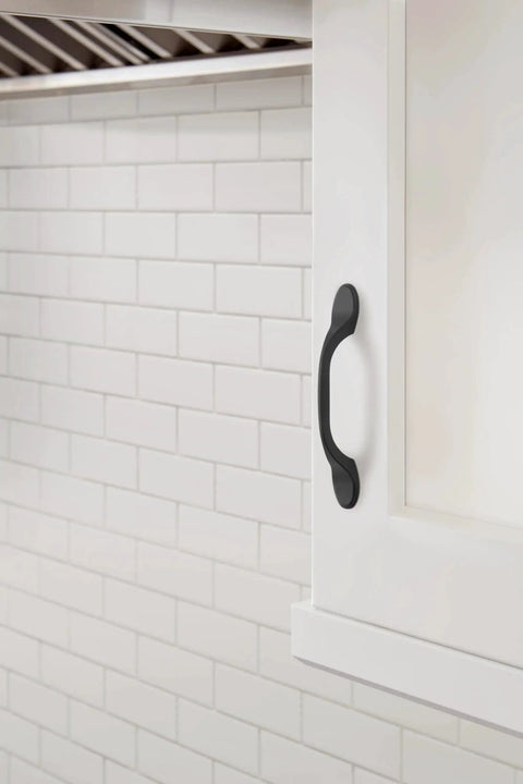Matte Black Ravino Cabinet Pull 3 Inch Center-To-Center 5 Inch Overall Length Transitional Drawer Handle on kitchen cabinet door