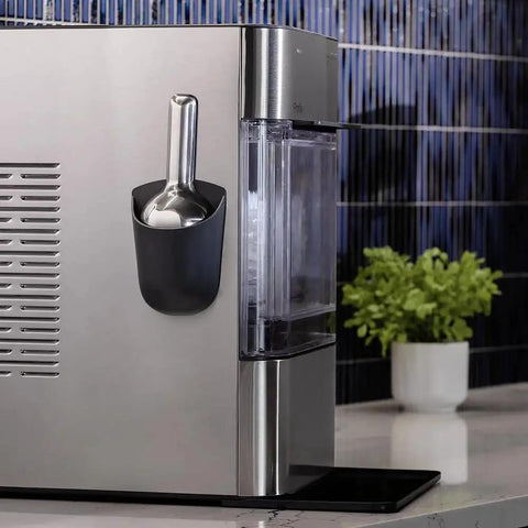 GE Profile Opal 2.0 Nugget Ice Maker With Side Tank Pellet Ice WiFi 38 Lb 24 Hr on countertop with scoop holder, side view