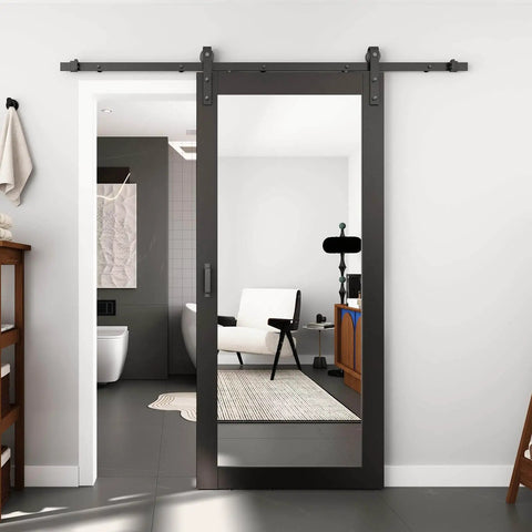 36 Inch Wide By 84 Inch Tall Mirror Barn Door Built Tough With 6.6 Foot Sliding Hardware Kit Included One Lite Full Length Glass Solid Wood Waterproof PVC Surface Scratch Resistant No Assembly Required Black, installed in a modern bathroom.