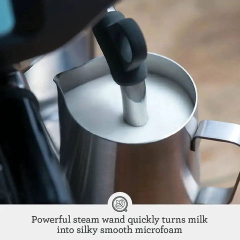 Barista Pro Espresso Machine With Built-In Grinder And 4 Keys Formula steam wand creating silky microfoam in milk jug