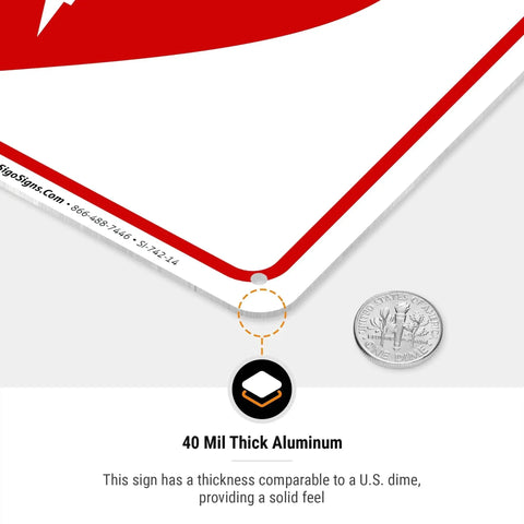 Close-up of 40 mil thick aluminum AED sign with U.S. dime for scale and predrilled hole detail