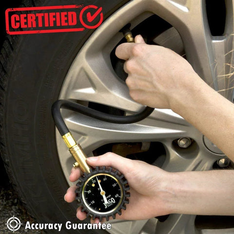 JACO ElitePro tire pressure gauge with brass nozzle attached to car tire valve (60 PSI).