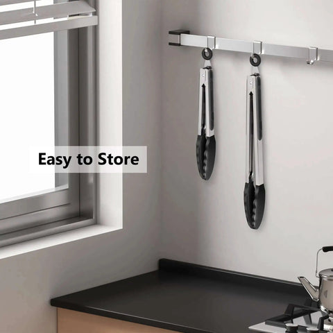 Two Pack Black Kitchen Tongs Set Pro Grade Silicone BPA Free Nonstick Stainless Steel BBQ Grilling Tongs hanging on rack