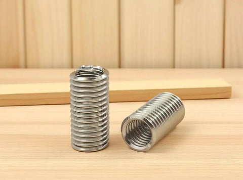 5/16-18 UNC 3D Helicoil Wire Thread Inserts Set in 304 Stainless Steel displayed on wooden surface.