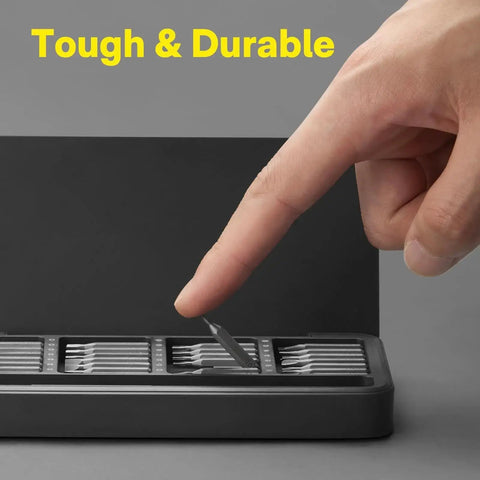 Close-up of a magnetic bit being picked up from the 28 In 1 Precision Screwdriver Set With Magnetic Bits And Case For Eyeglasses Electronics Watches Phones Laptops And Cameras, Featuring 360 Degree Swivel Cap For One Handed Use And Quick Bit Changes Mini Repair Kit.