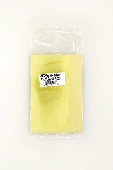Assorted Brass Sheet Shim Set for Hobbyists and Model Builders, 24 Piece Kit, packaged brass shims in plastic bag, front view.