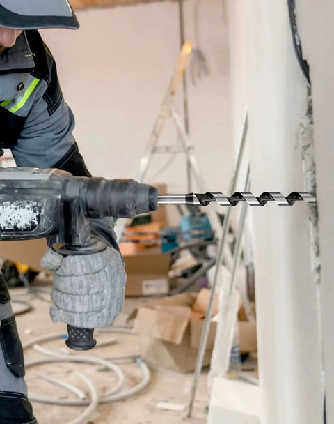 Worker using heavy duty wood auger drill bit for fast drilling with self feeding coarse screw point one half inch diameter sixteen inch length