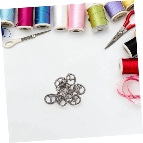 Handy Mini Buckle Sewing Kit 150 Piece Set for Doll Clothes and DIY Craft Projects on a crafting table with tools and threads.