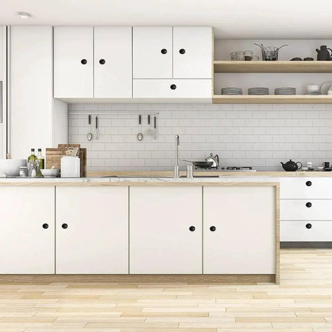 Modern kitchen with white cabinets featuring Black Round Cabinet Knobs Set Of 50 Pieces, 1.2 Inch Diameter, installed with 1 inch screws.