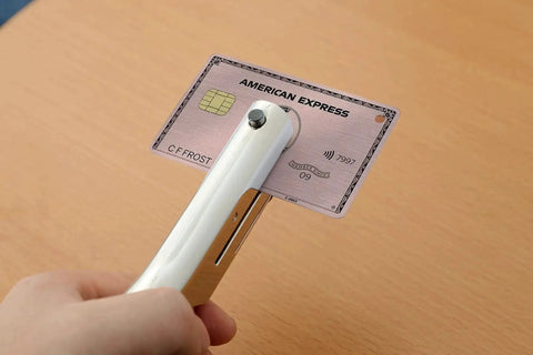 Person using Beefy Heavy Duty 1/8 Inch Single Hole Punch With Ultra Long Depth Up To 53mm on a plastic card, showing precise hole punch.