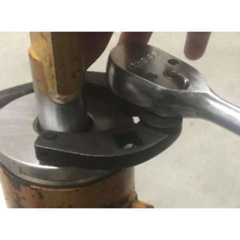 Universal Gland Nut Wrench for Hydraulic Cylinders removing gland nut on equipment, 42CrMo steel, 1"-3.75" range shown in use.