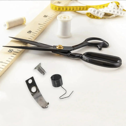 Scissors with Pro Grade Sewing Machine Replacement Screw Kit with Spring Set, including spring, bobbin, and fastener visible.