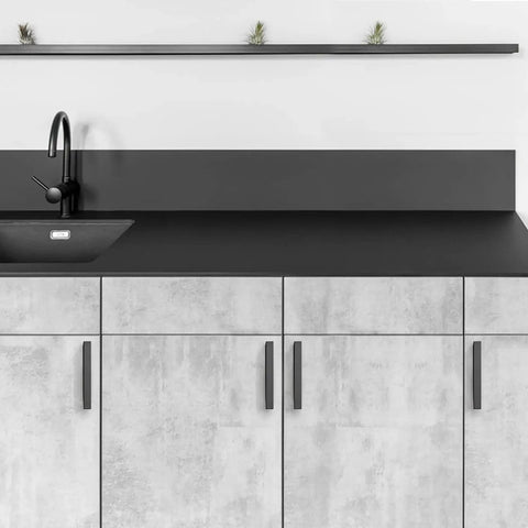 Black 5 Inch Square Cabinet Pulls 30 Pack on modern kitchen cabinets with stainless steel handles, sink, and black countertop.
