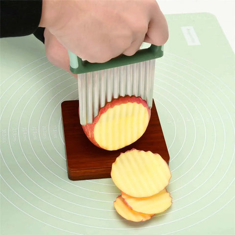 Versatile Vegetable Chopper With Wavy Crinkle Cutter For Veggies And Fries, Stainless Steel Blade slicing apple on cutting board