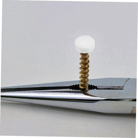 Close-up of white plastic screw cover cap with metal screw for furniture, part of the Plastic Screw Cover Caps Set 400 Pieces Hinged Design