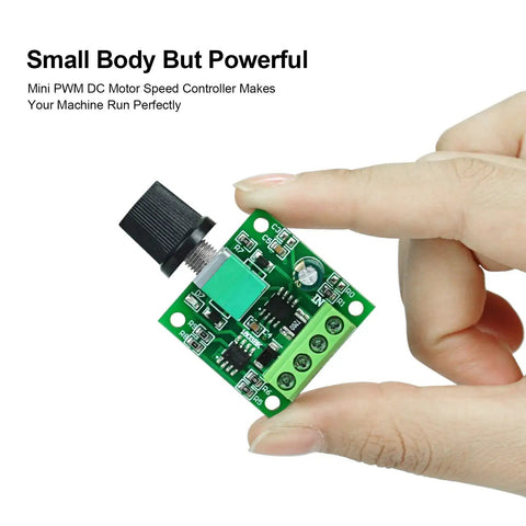 Low Voltage PWM DC Motor Speed Controller 1.8V To 12V 2A 24W Adjustable Driver Switch held between fingers showing circuit board details