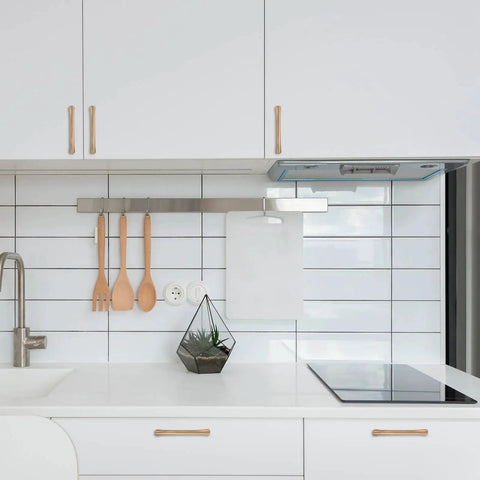 Modern kitchen with 10 Pack 5 Inch Champagne Bronze Cabinet Handles For Kitchen Cabinets And Furniture Pulls installed on white cabinets.