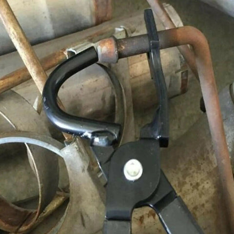 Close-up of Exhaust Hanger Removal Tool Pliers Compatible With All Exhaust Rubber Hangers in use on a metal pipe.