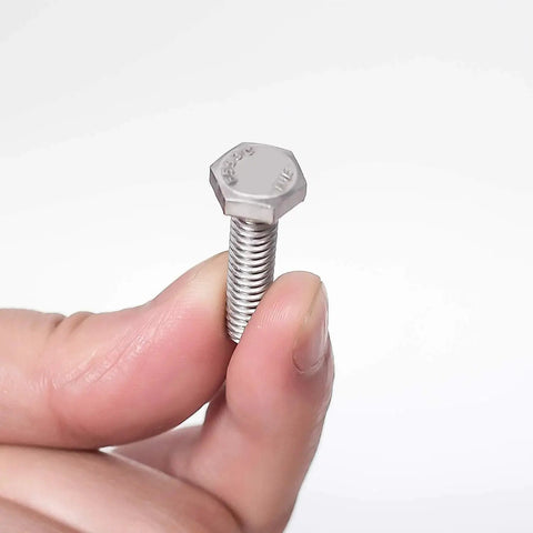 Close-up of a Beefy Heavy Duty Stainless Steel Hex Bolt 1/4-20, 1-1/2 inch in hand, part of the Set Of 100 Fasteners by KINJOEK.