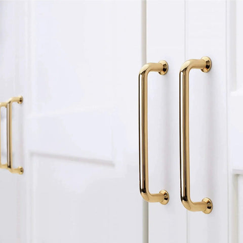 10 Pack Polished Brass Cabinet Pulls Five Inch Center To Center Spacing Five Point Six Inches Overall Length zinc alloy installed on white cabinets