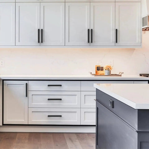 Modern kitchen with 10 Pack Matte Black 5 Inch Hole Center Kitchen Cabinet Pulls ZH0005MB installed on white cabinetry.