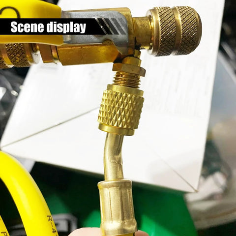 AC refrigerant charging hose with brass 1/4 in SAE flare fittings and knurled coupling; yellow hose visible