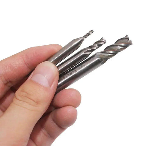 Hand holding End Mill Set For CNC Routing 10 Pc Sizes From 0.08 Inch To 0.47 Inch 4 Flute HSS Straight Shank Cutter Bits