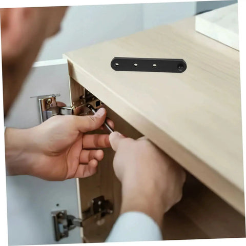 Person installing 4 Pack Stainless Steel Concealed Hinges For Doors And Windows Hidden Cabinet Hinges With High Load Capacity on cabinet