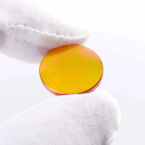 CO2 Laser Lens 20mm Diameter ZnSe PVD Coated, 50.8mm Focal Length, shown in hand for size reference.