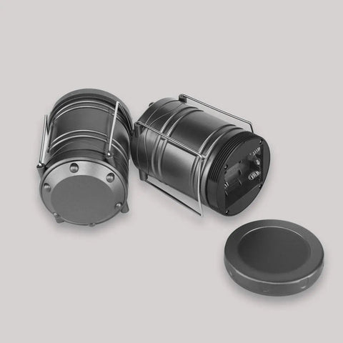 LED Camping Lantern 4 Pack Battery Powered Emergency Light 360 Degree Coverage, two black lanterns, collapsible with handles.