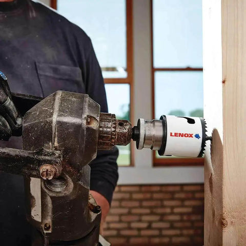 Bi Metal Speed Slot Hole Saw Two And Three Quarter Inch for Metal and Wood installed on drill cutting wood