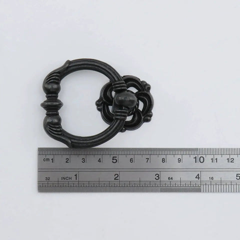 Antique Bronze Ring Pull Handle with ruler for size comparison, part of Antique Bronze Ring Pull Handles Set Of Four For Cabinets And Drawers Vintage Style Cabinet Pulls With Screws Included Durable Metal Construction Smooth Classic Ring Design Easy To Install Enhances Kitchen And Furniture Decor