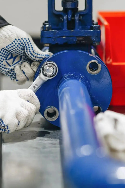 Technician tightening pipe flange using a spanner, relevant to 50 Pieces Nylon Insert Hex Lock Nuts Size 8 32 Threads A2 304 Stainless Steel Self Locking Nuts For Industrial Construction Fasteners Built To Last Indoor Outdoor Use applications.