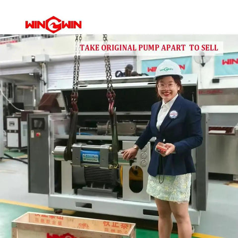 Person standing next to industrial machinery with "TAKE ORIGINAL PUMP APART TO SELL" sign in factory setting.