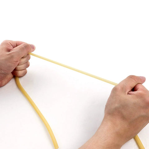 Latex rubber tubing, natural color, 1/4 in OD × 3/16 in ID, being stretched between hands.