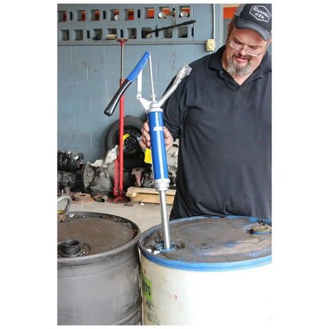 Man using Lincoln 1340 Lever Action Barrel Pump for Industrial and Automotive Lubrication and Fluid Transfer, Heavy Duty Quick Prime