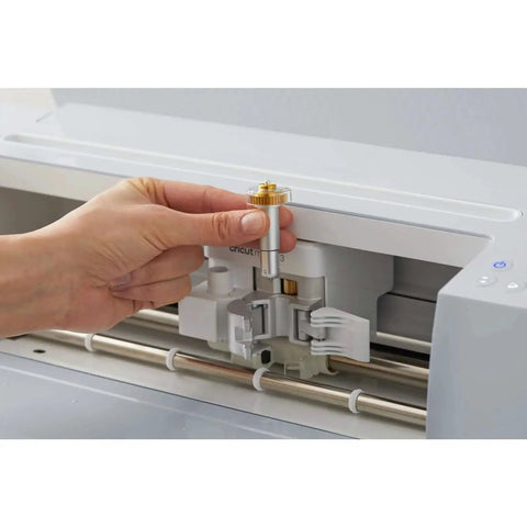 Pro Grade Engraving Tip With QuickSwap Housing And Premium Carbide Steel for Cricut Maker being installed by hand