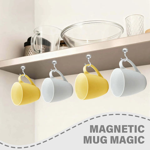 Yellow and white mugs hanging from magnetic hooks under a kitchen shelf with bowls and glasses displayed above.