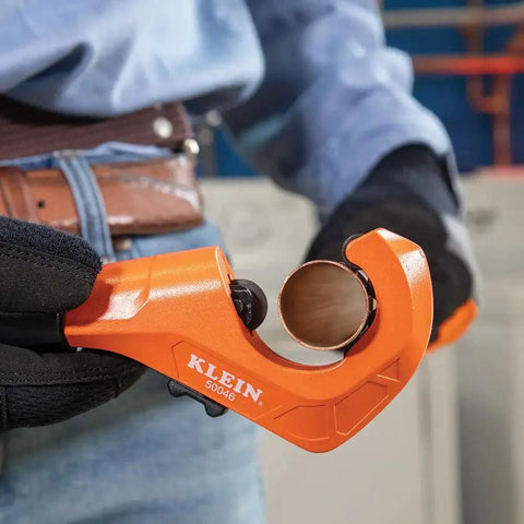 Close-up of Constant Swing Workhorse Tubing Cutter for copper and aluminum pipes, showing ergonomic design in use.
