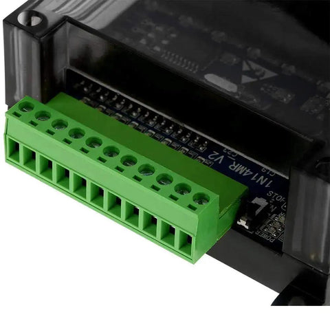 Close-up of DC 24V FX1N 14MR PLC with relay output terminal, showing green connector and industrial-grade design.