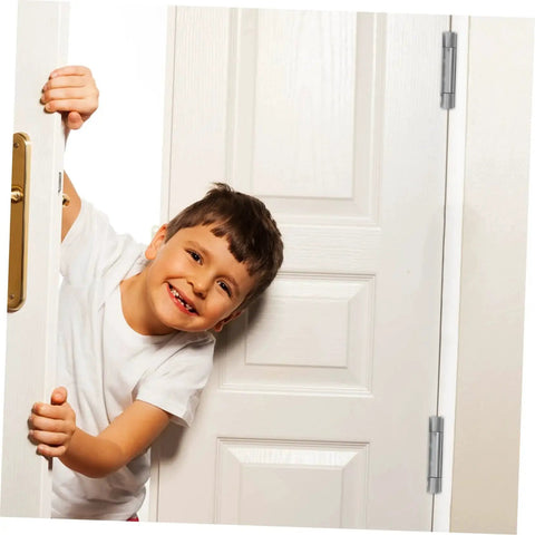 Child peeking through a white door with heavy duty spring loaded double swing door hinges for backyard doors self closing mechanism built to last